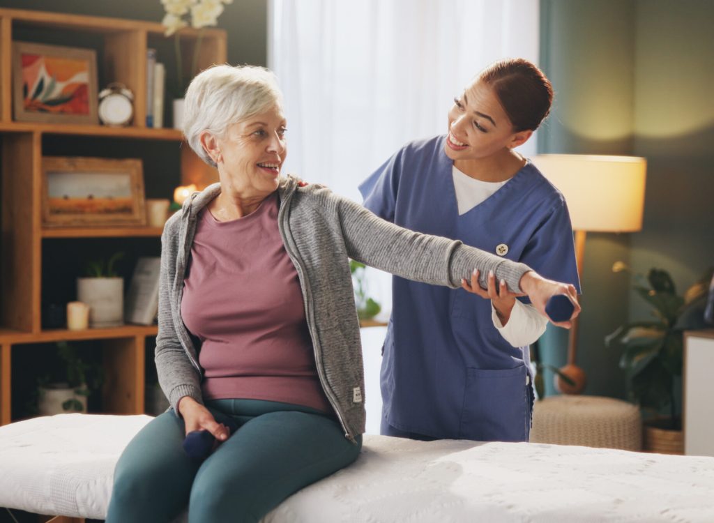 women-caregiver-senior-patient-with-dumbbells-rehabilitation-support-healthcare-people-nursing-home-physiotherapist-fitness-exercise-training-wellbeing-arthritis Women, caregiver and senior patient with dumbbells for rehabilitation, support and healthcare. People, nursing home and physiotherapist for fitness, exercise and training for wellbeing or arthritis.